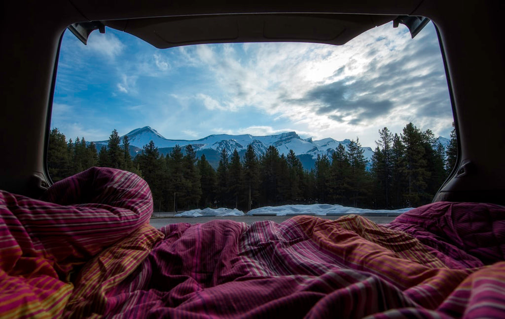Cosy sleep setup inside tent for car camping