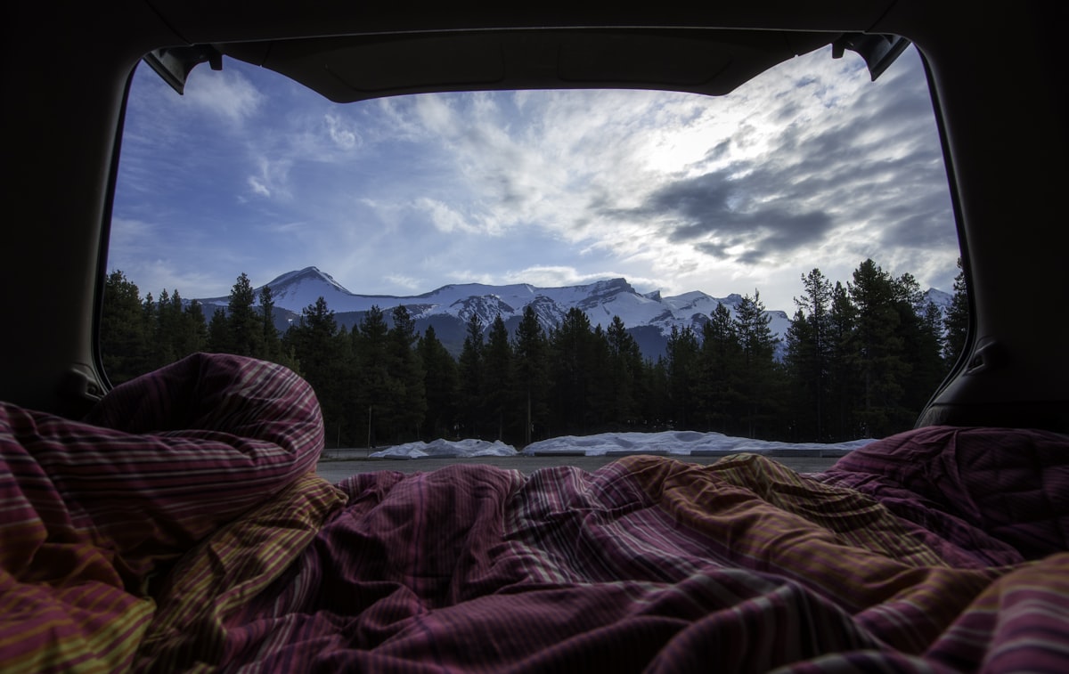 Cosy sleep setup inside tent for car camping